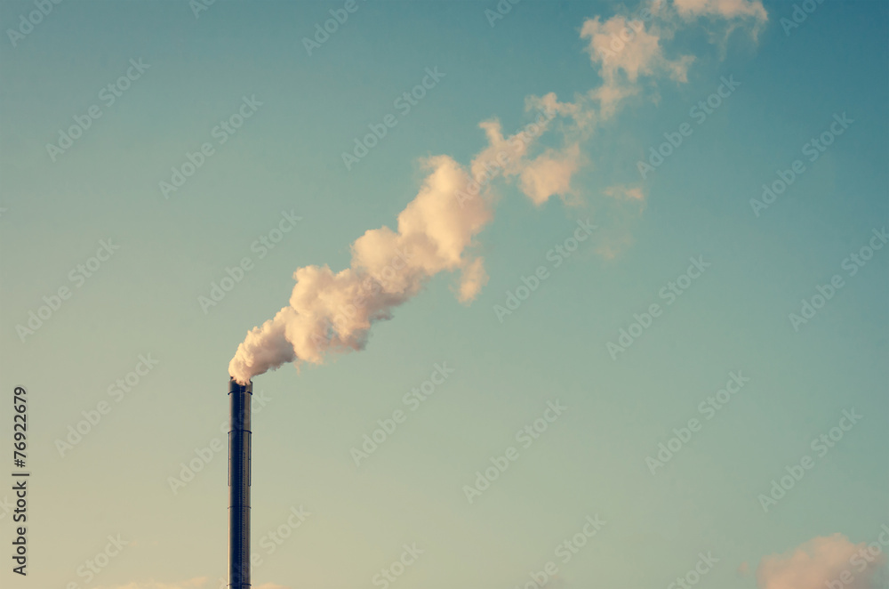 Factory with smoking chimney