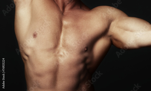 Body of muscular man © Arman Zhenikeyev