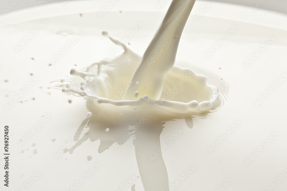 Splash of milk photo. Closeup. Splash of milk photo. Closeup.