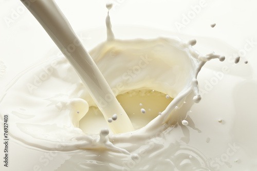 Valokuvatapetti Splash of milk photo. Closeup.