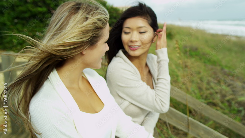 Laughing Multi Ethnic Female Friends Together Fall Beach Laughing Multi Ethnic Female Friends Together Fall Beach