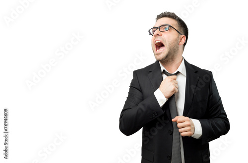 Businessman suffering from stress and screaming