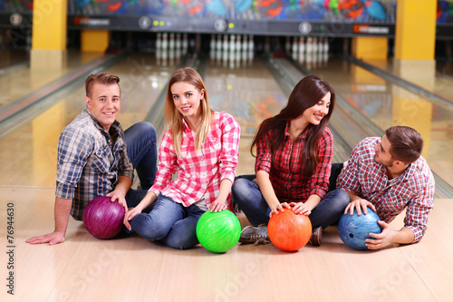 Portrait of friends in bowling club