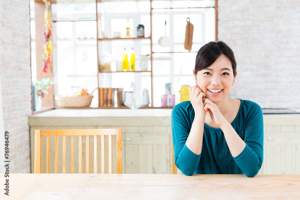 young asian woman in the kitchen young asian woman in the kitchen
