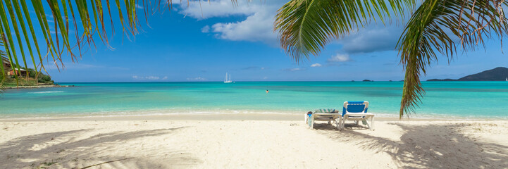 Tropical white sand beach background, caribbean island, hot summer day on the beach