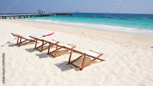 Beach chairs on sand beach