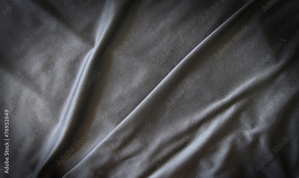 Obraz premium Black creased material background or texture