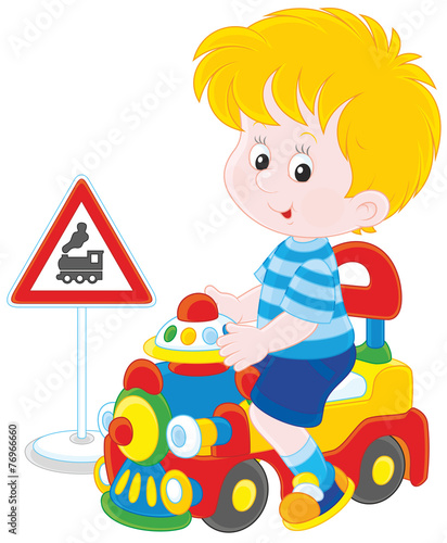 Boy on a toy train