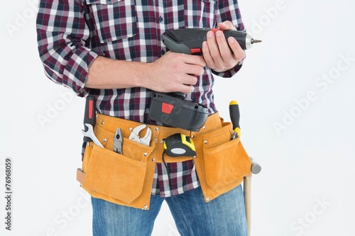 Handyman holding drill machine