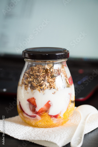 Granola with Fruits and Yogurt Ready to Take to Work as a Snack