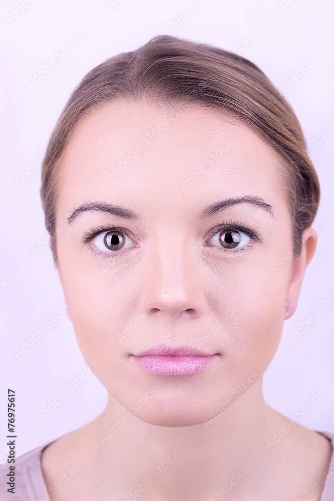 Applying makeup on female face, isolated on white Applying makeup on female face, isolated on white
