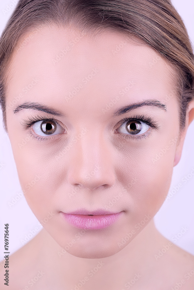 Applying makeup on female face, on white background Applying makeup on female face, on white background