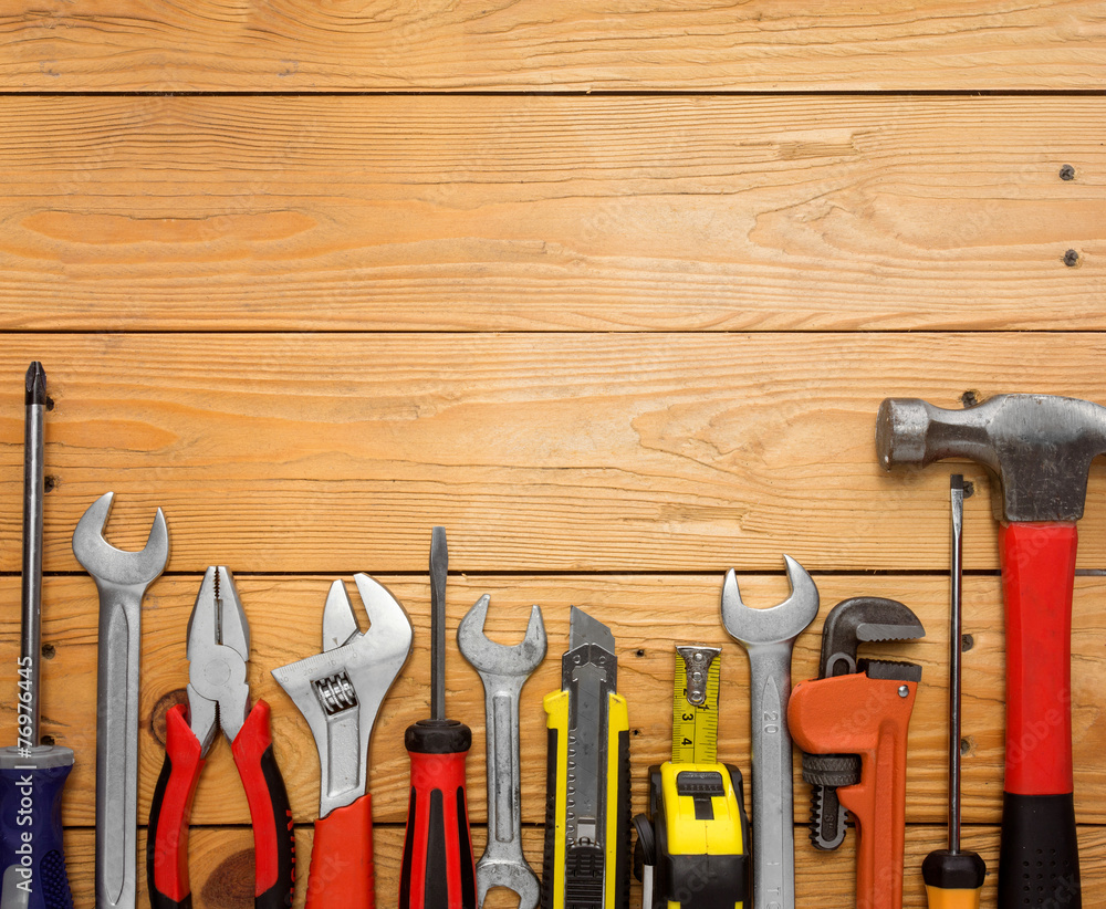 Set of tools over a wood panel Set of tools over a wood panel