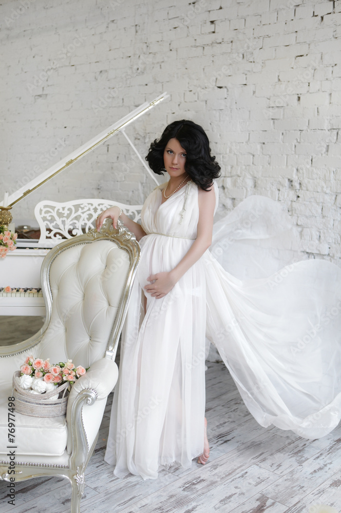 Portrait of the young pregnant woman