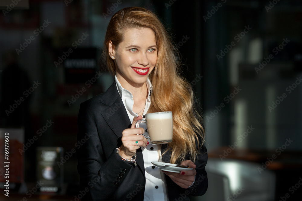 portrait of a beautiful woman with a cup of cappuccino portrait of a beautiful woman with a cup of cappuccino
