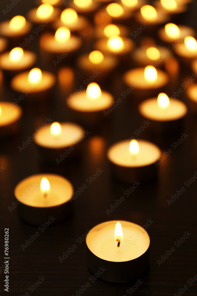 Burning candles on dark background Burning candles on dark background