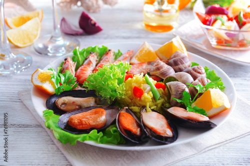 Seafood Paella on plate on table close-up