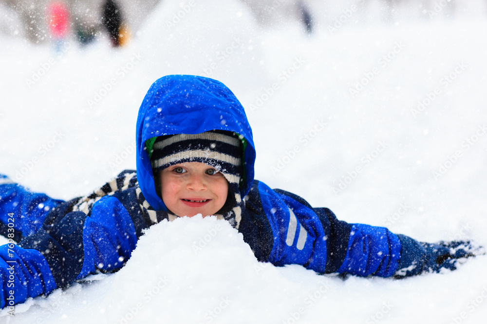 Little boy having fun in snow Little boy having fun in snow