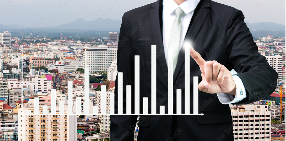 Businessman standing posture hand touch graph finance Businessman standing posture hand touch graph finance