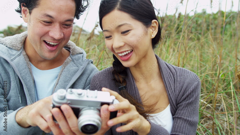 Attractive Young Asian Chinese Couple Using Camera Outdoors Fall Attractive Young Asian Chinese Couple Using Camera Outdoors Fall