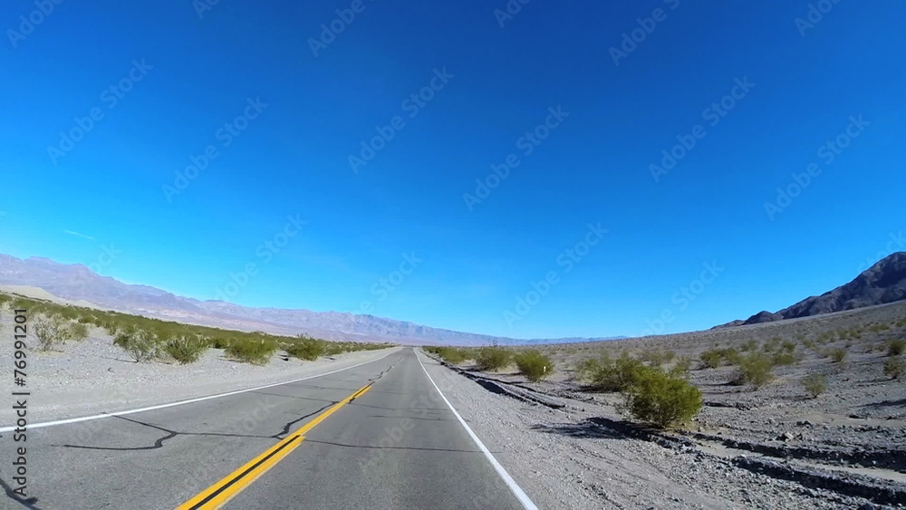POV Death Valley driving desert landscape Wilderness Mojave Desert sun flare USA POV Death Valley driving desert landscape Wilderness Mojave Desert sun flare USA