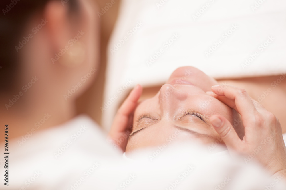 Foto Stock Woman getting professional facial massage Adobe Stock