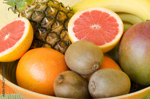 Delicious tropical fruit in the wooden bowl