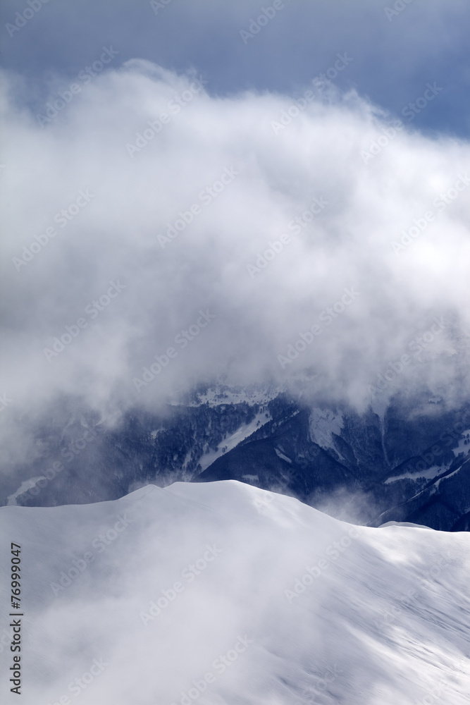 Off-piste slope at mist