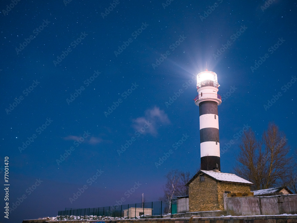 Naklejka premium Riga Lighthouse in a starry night
