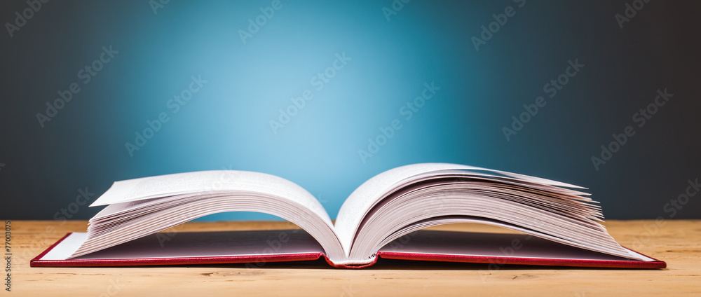 Fototapeta premium book on wooden table