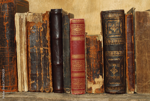 Ancient books on wooden background.