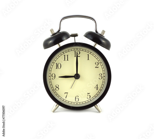 Alarm clock in black case shows 9 o'clock isolated