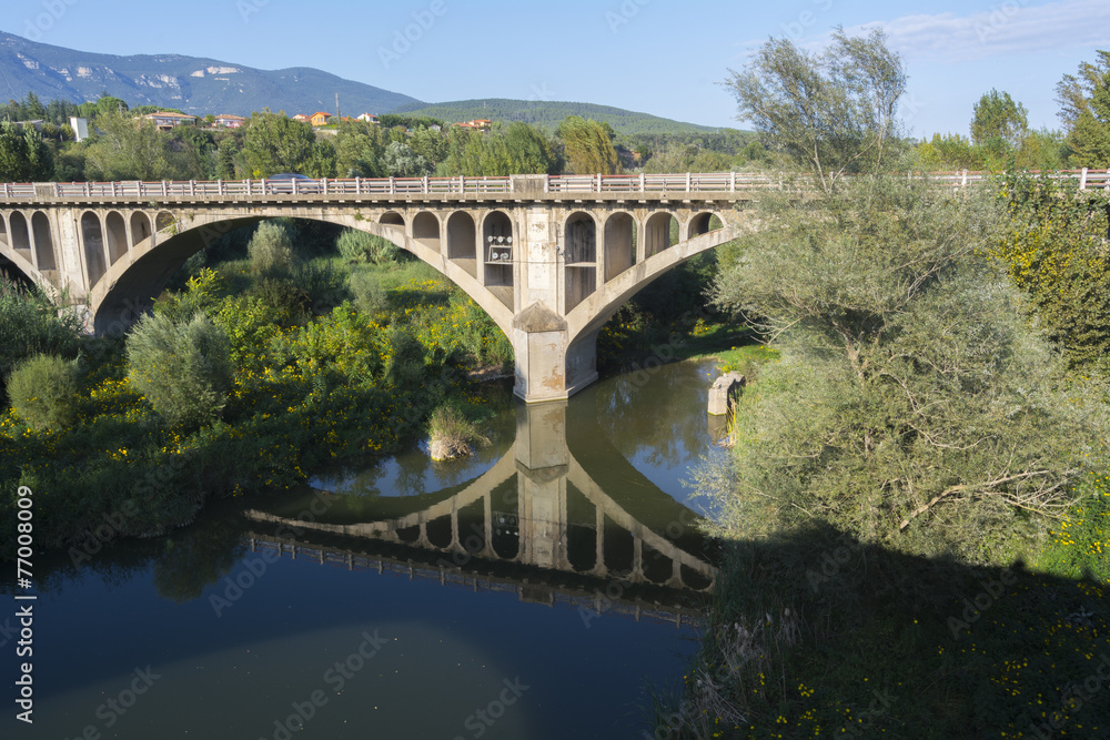 Reflection of bridge over rive