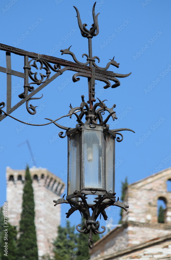 Medieval street lamp in Assisi, Italy