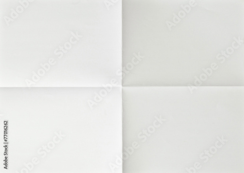 white sheet of paper folded in four
