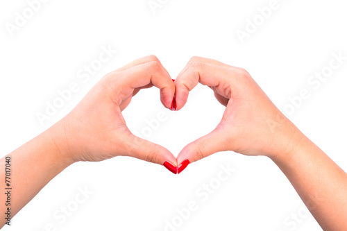 Shape of the heart made by female hands isolated on white