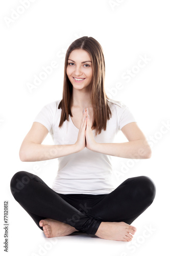 Beautiful yogi female sitting in lotus position