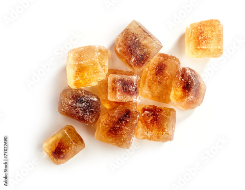 Brown caramelized sugar cubes on a white background