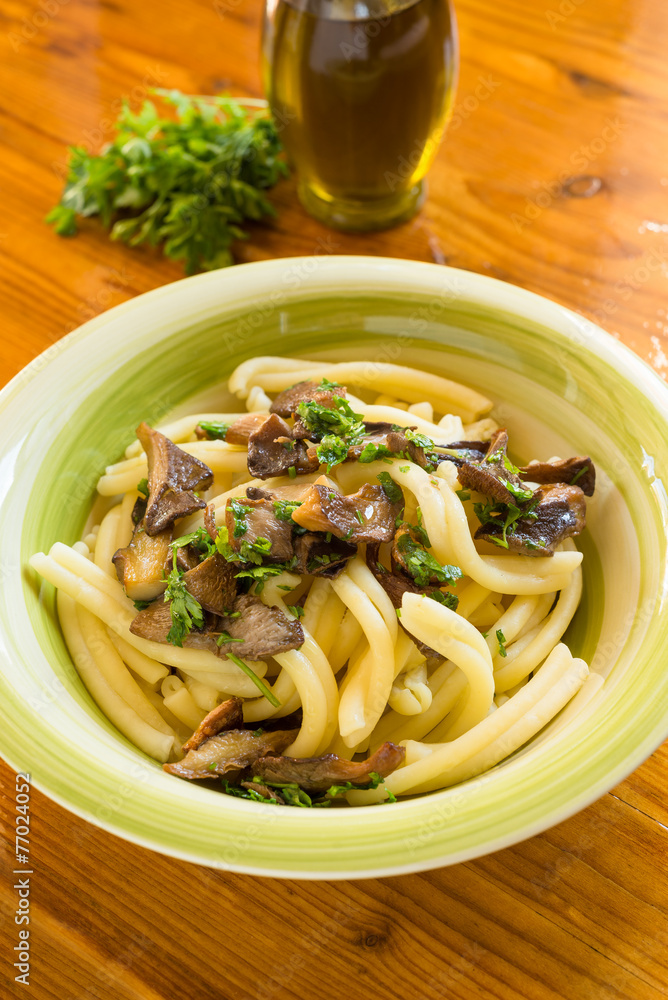 Pasta casereccia con funghi, italian cuisine Pasta casereccia con funghi, italian cuisine