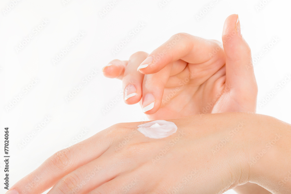 Beautiful young woman hands with cream, isolated on white Beautiful young woman hands with cream, isolated on white