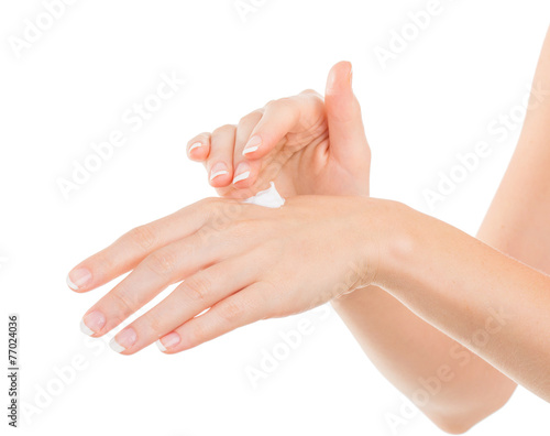 Beautiful young woman hands with cream  isolated on white
