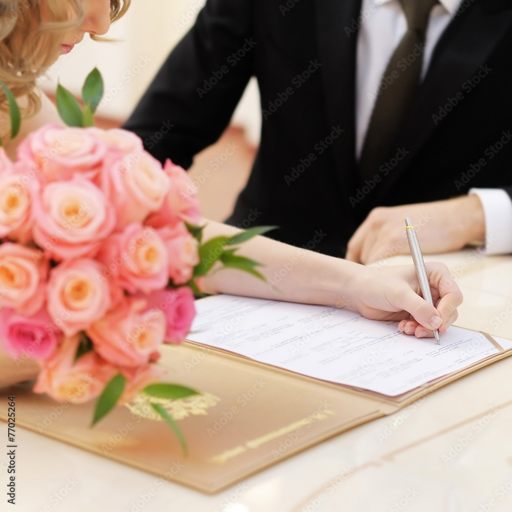Bride signing marriage license Bride signing marriage license