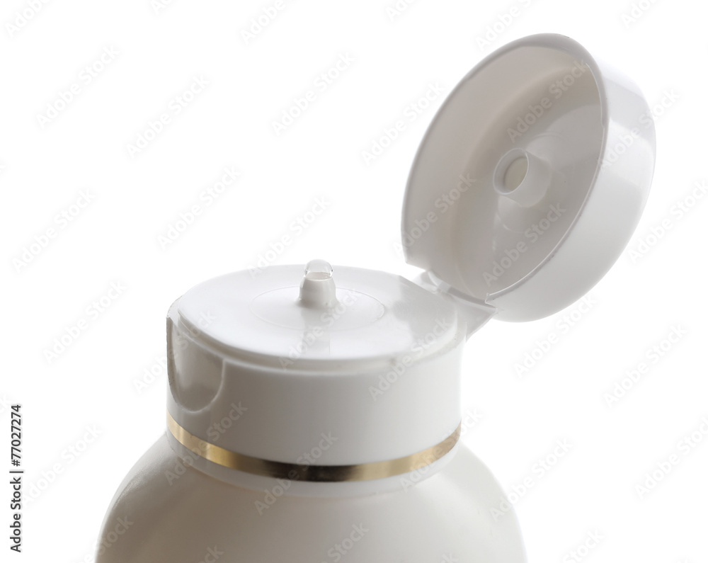 Open cosmetic bottle isolated on white
