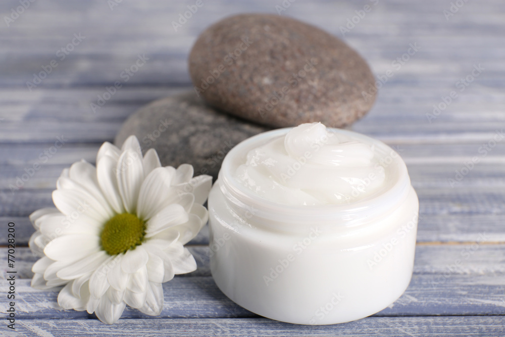 Cosmetic cream with spa stones and chamomile Cosmetic cream with spa stones and chamomile