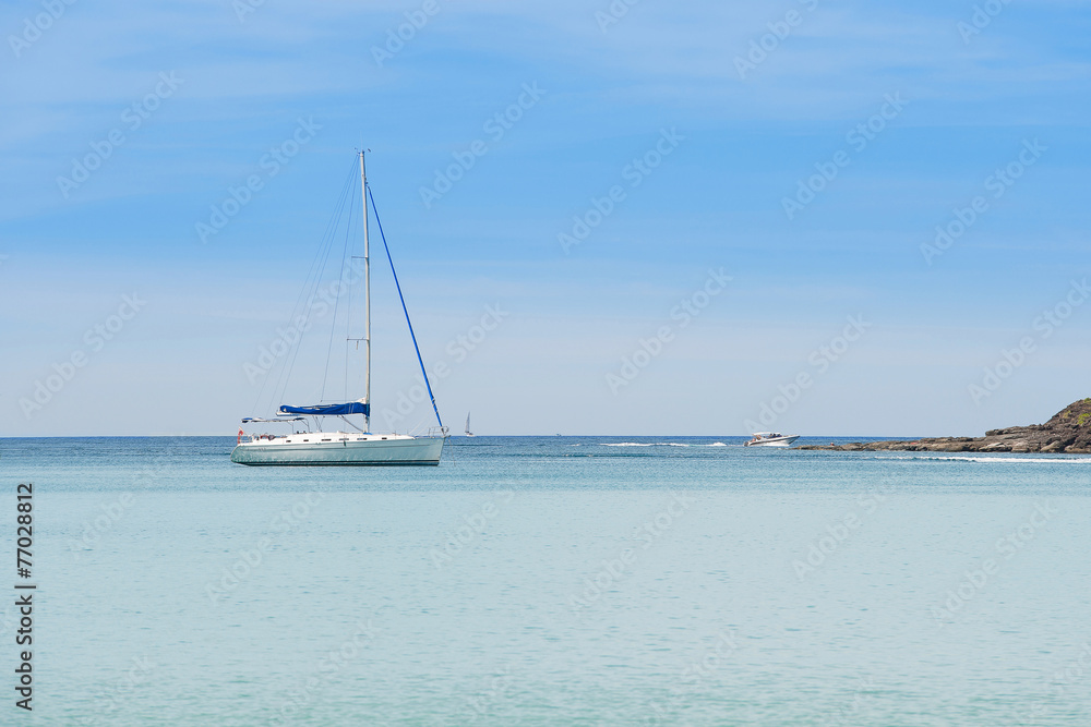 Yacht sailing on tropical sea at windy day