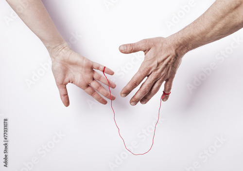 Woman and man with red string of fate photo