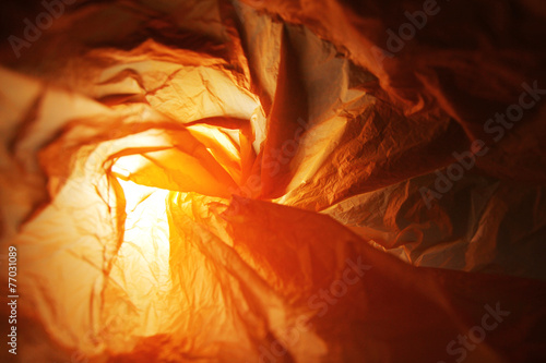 Abstract background of the insides of an orange plastic bag