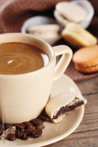 Gentle colorful macaroons and  coffee in mug