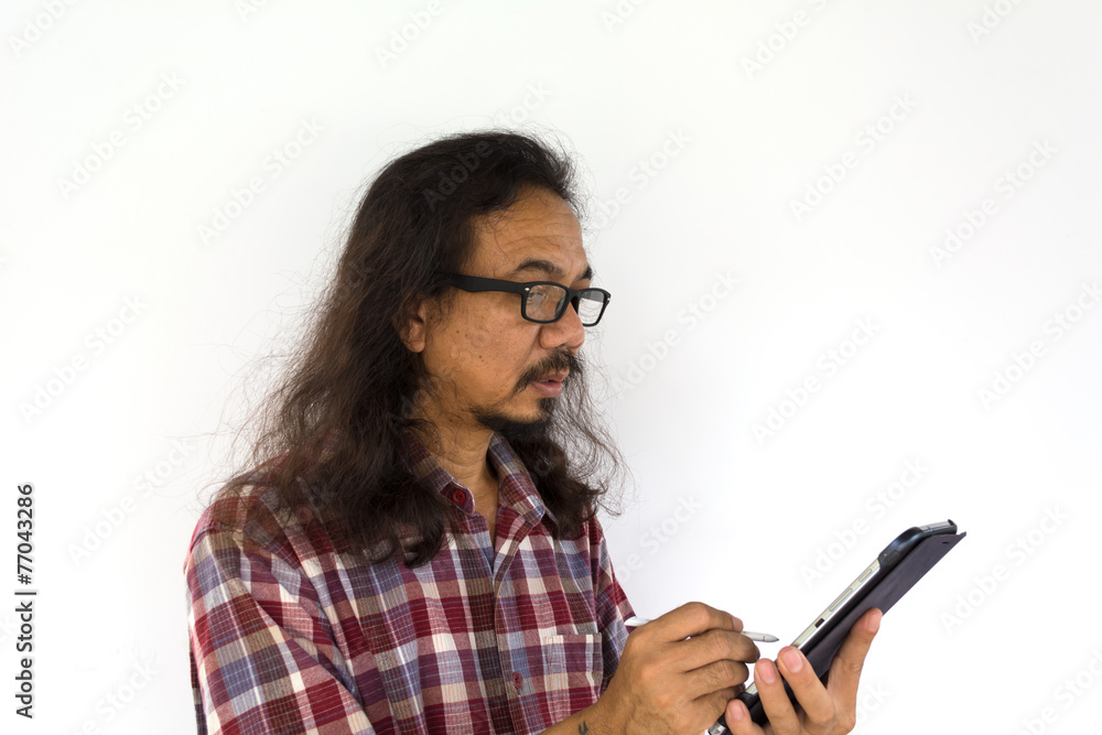 Old asian man using tablet-pc on white background. Old asian man using tablet-pc on white background.