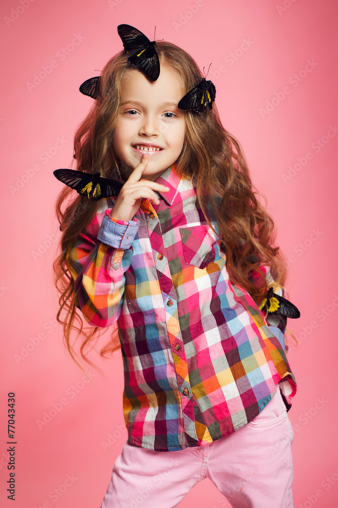 Studio portrait of a little girl with tropical butterflies. Studio portrait of a little girl with tropical butterflies.